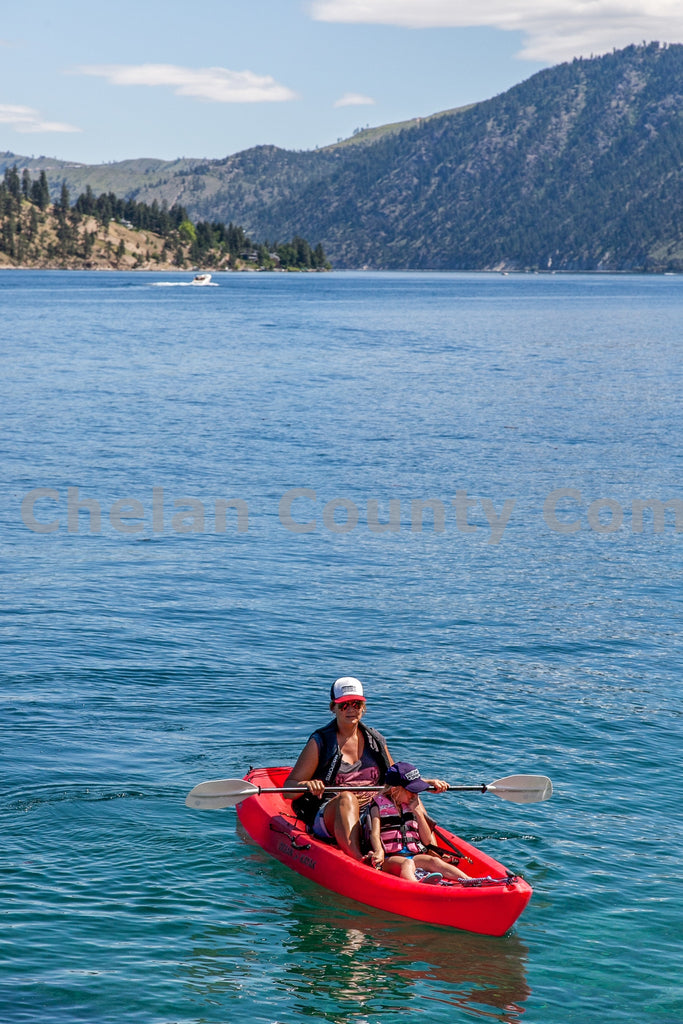 Kayaker And Kid On Lake Chelan, by Travis Knoop | Capture Wenatchee